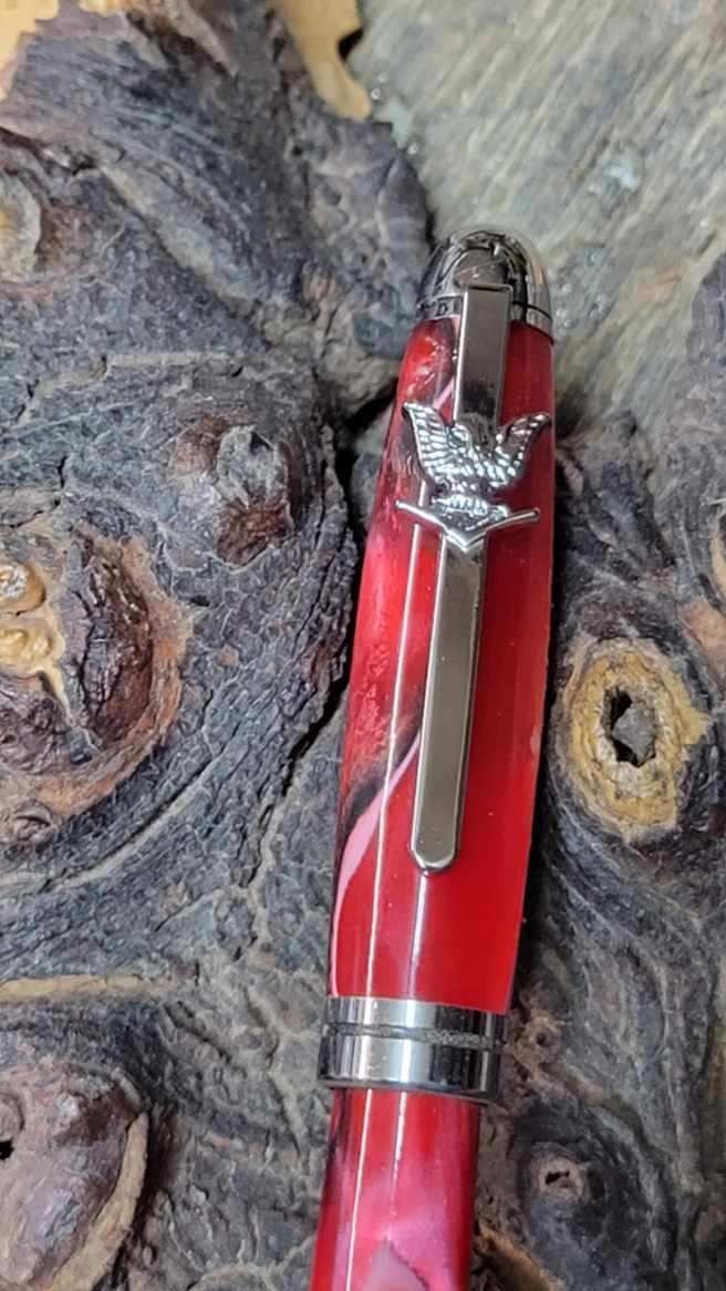 Elegant red pen on textured surface