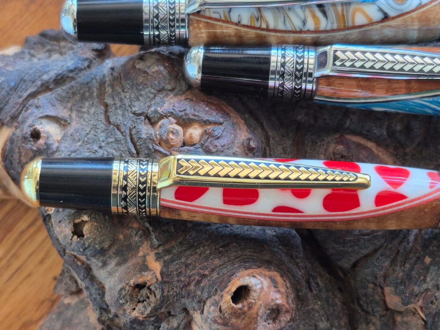 Colorful pens with intricate designs displayed