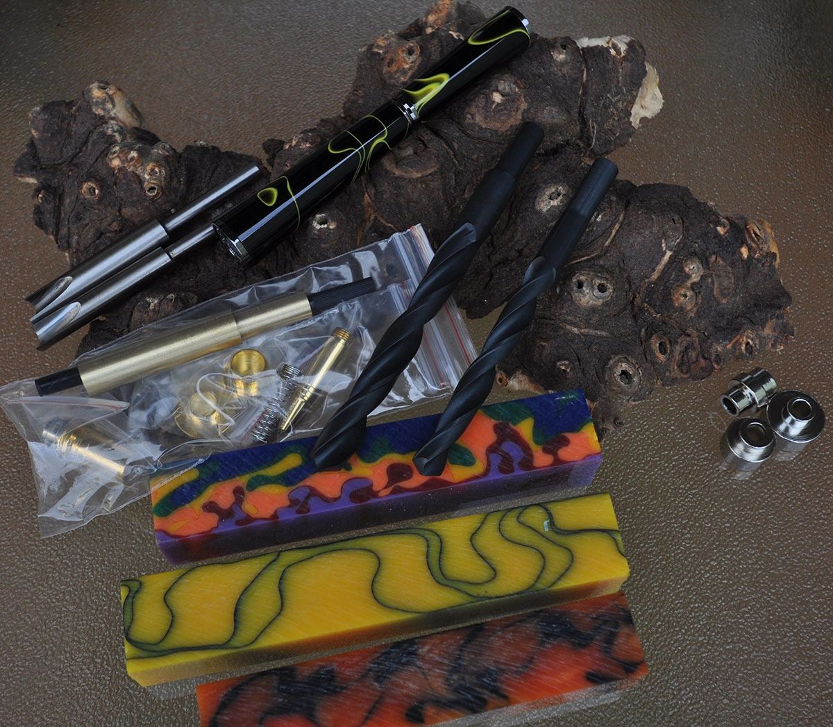 Assorted pen parts, blanks, and drill bits