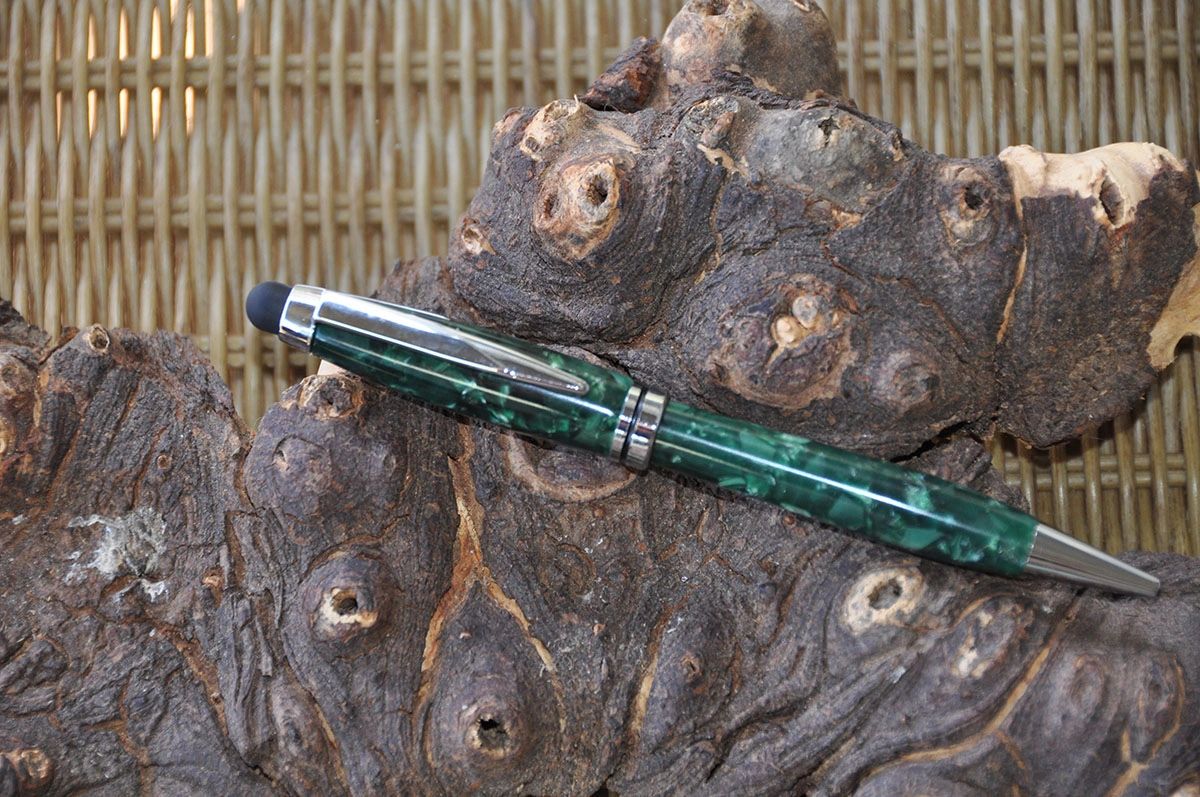 Elegant pen resting on rustic wood