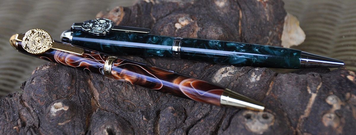 Elegant pens on textured wooden surface