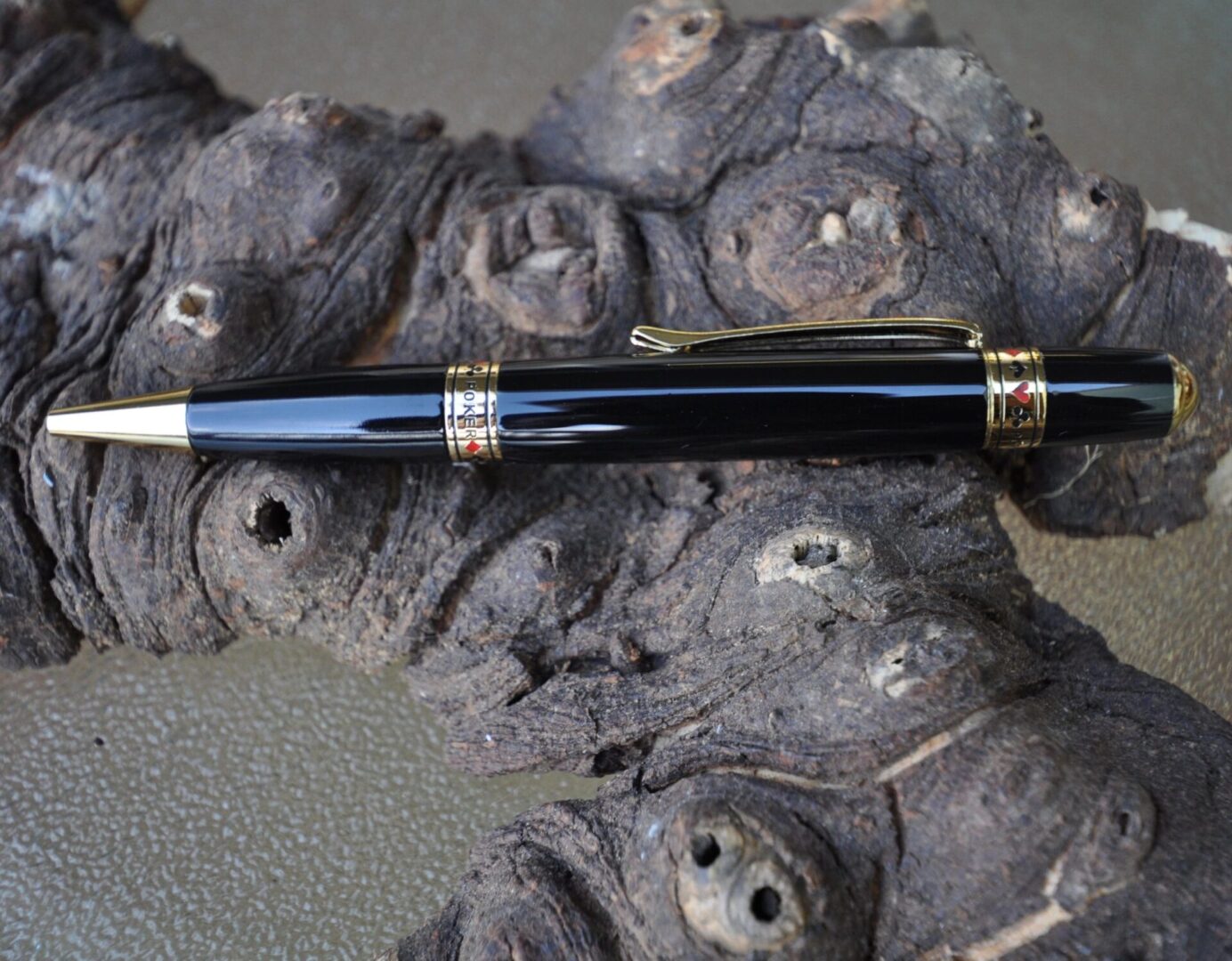Elegant pen resting on rustic surface