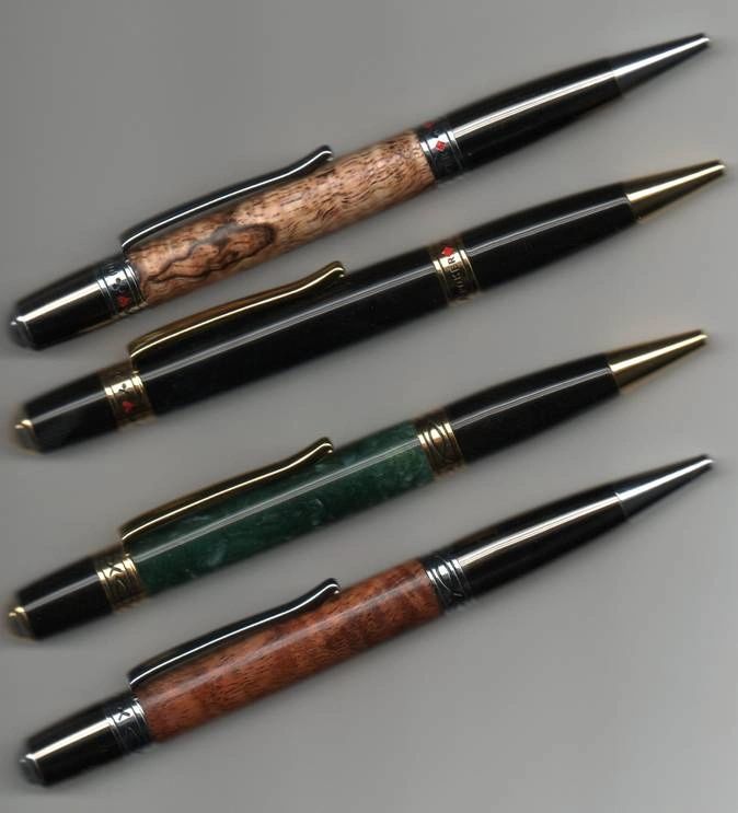 Assorted pens with gold and silver accents