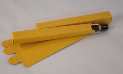 Yellow pencil boxes with pencils inside