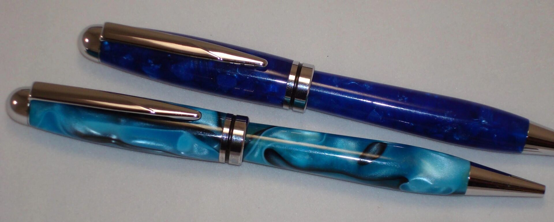 Elegant blue and teal writing instruments