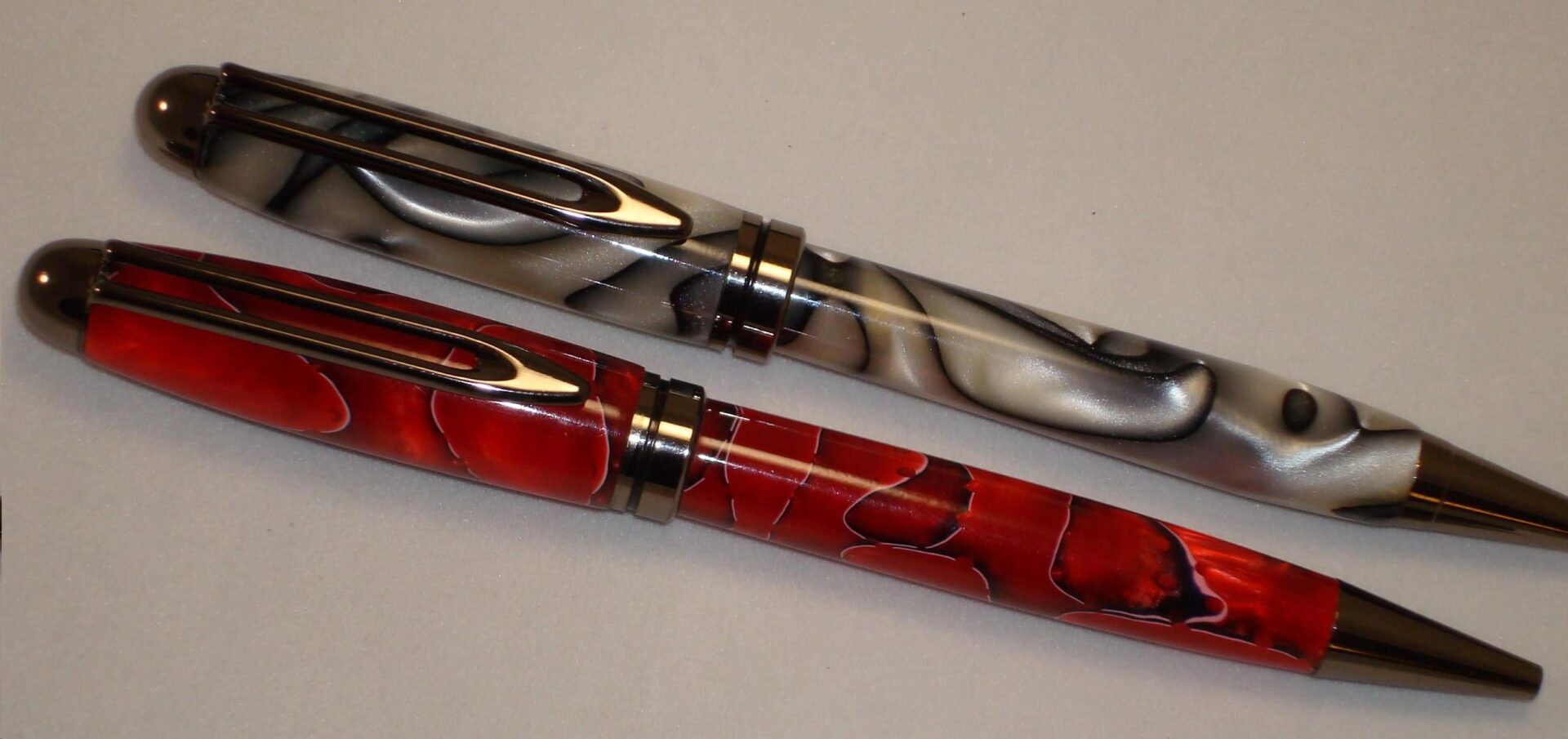 Decorative red and gray pens