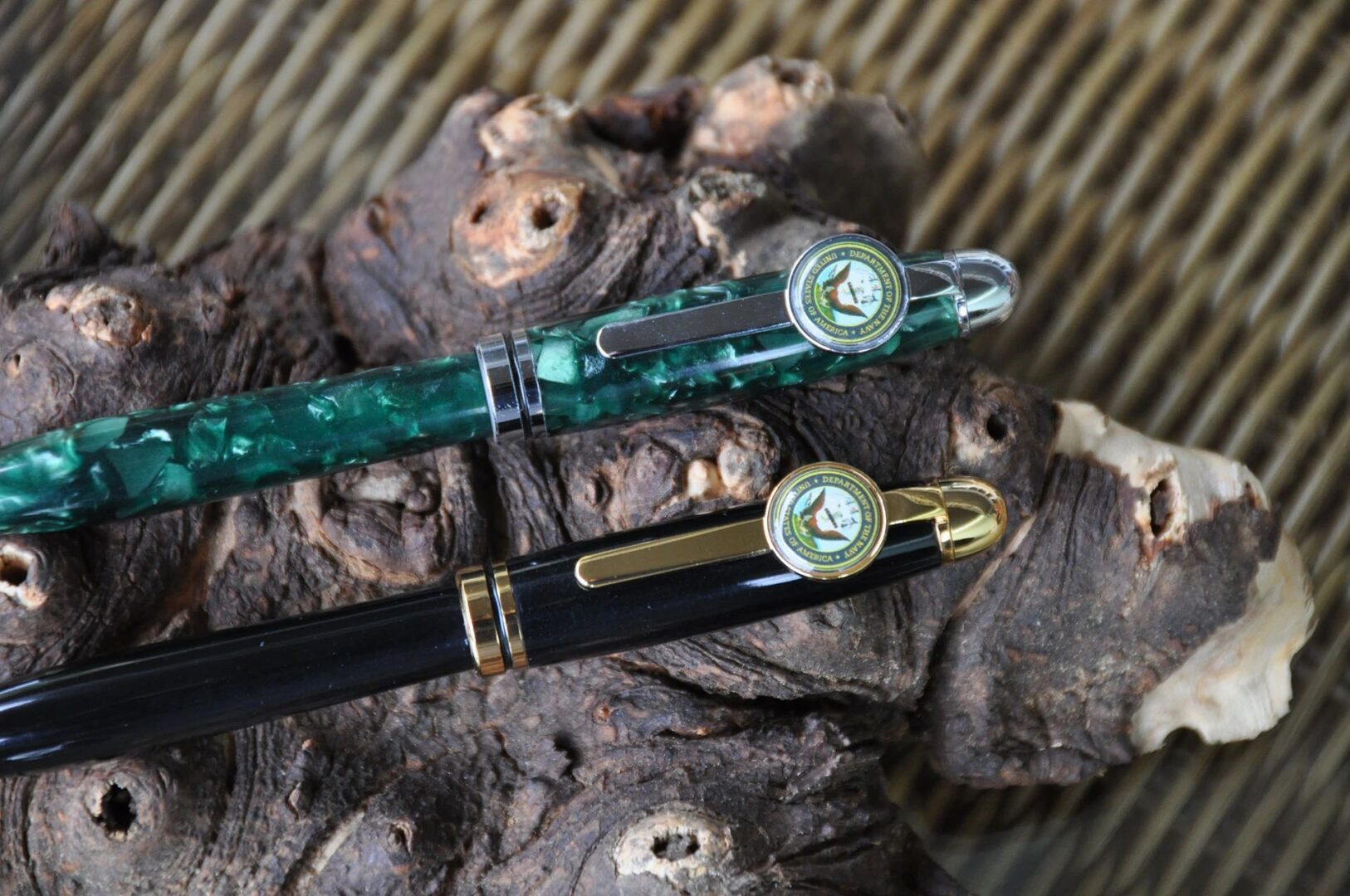 Elegant pens on rustic wood surface