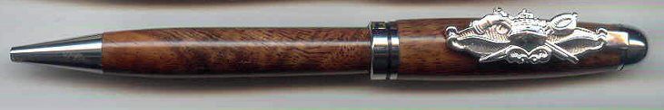 Ornate pen featuring intricate metal design