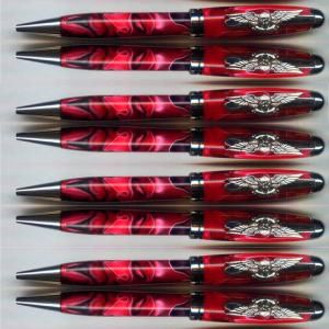Eight decorative red and silver pens
