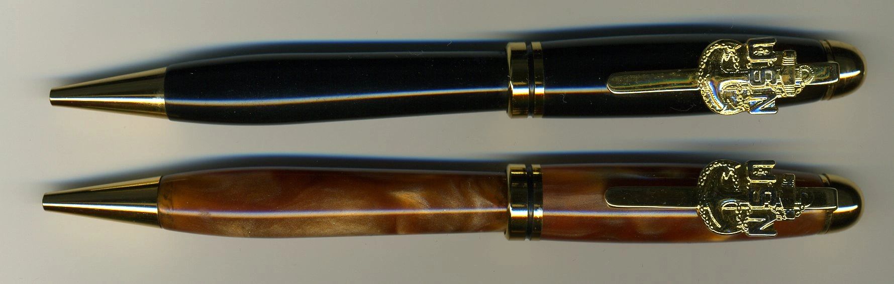 Two luxury pens on display