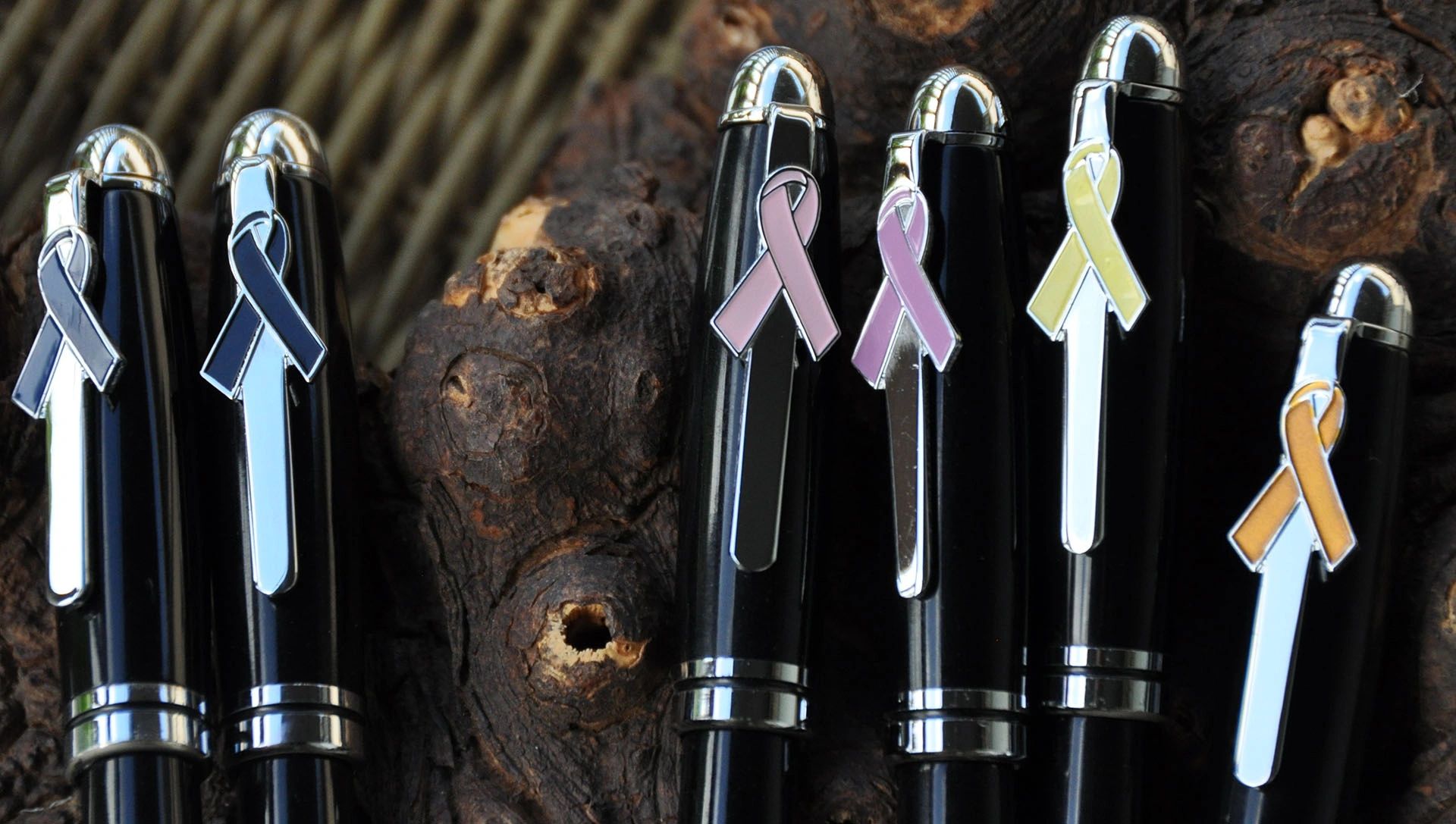 Black pens with awareness ribbons