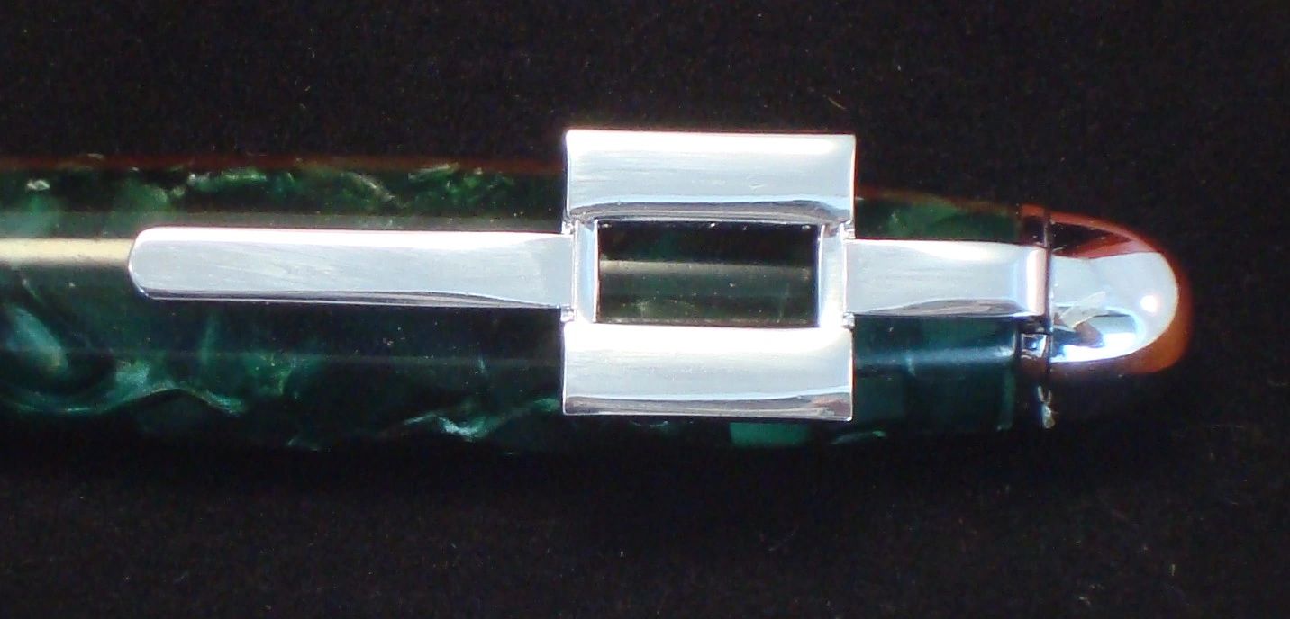 Green pen with silver clip detail