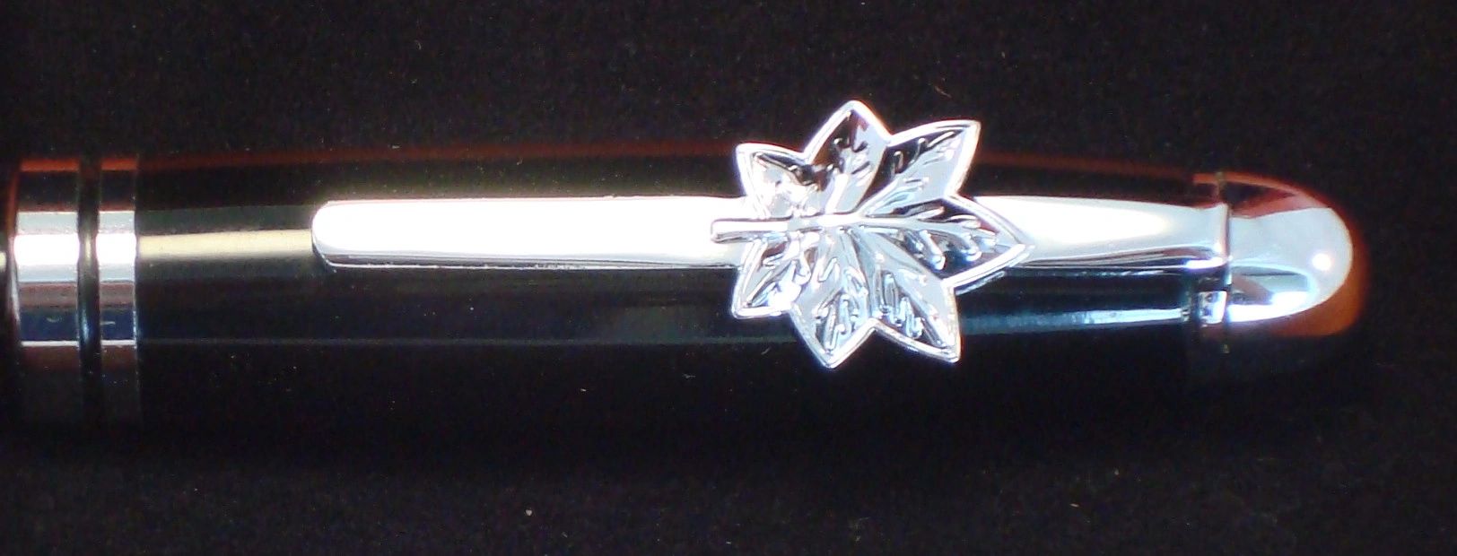 Elegant pen featuring maple leaf motif