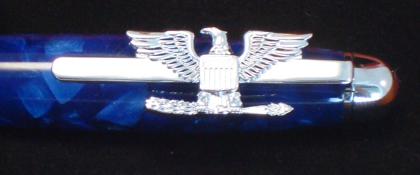 Silver eagle decorates blue pen body