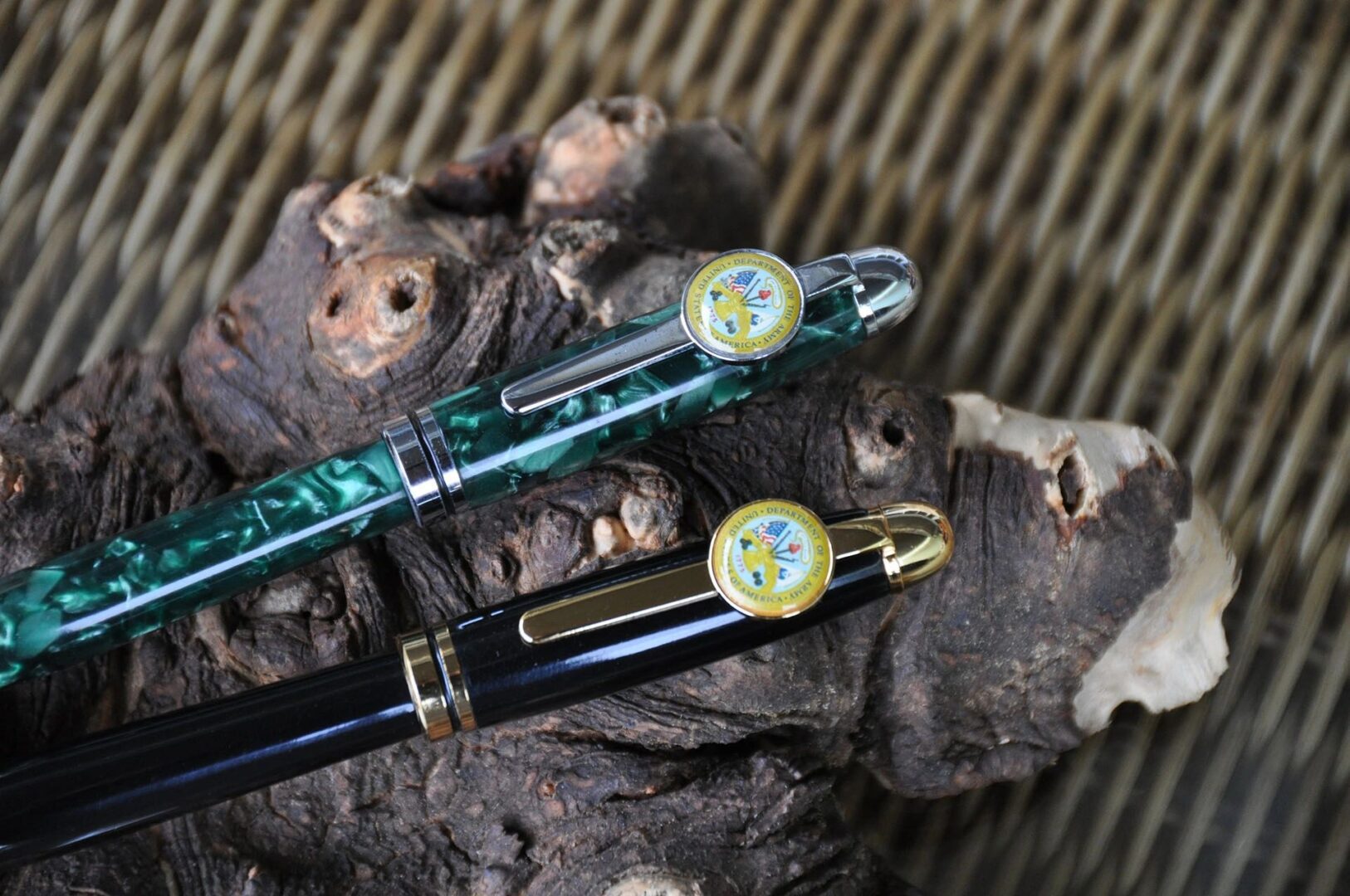 Decorative pens resting on natural wood