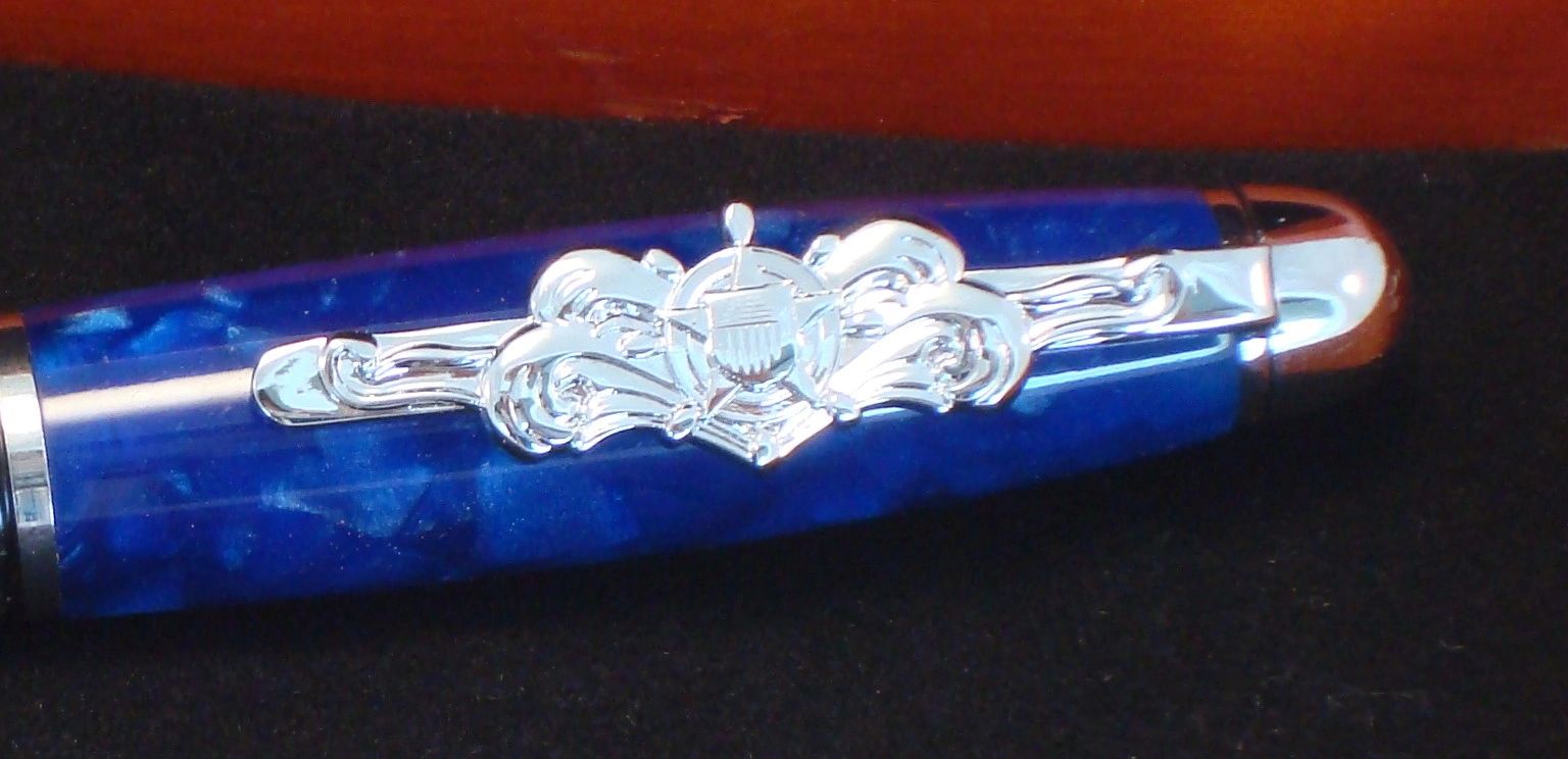 Blue pen cap with silver decorative clip.