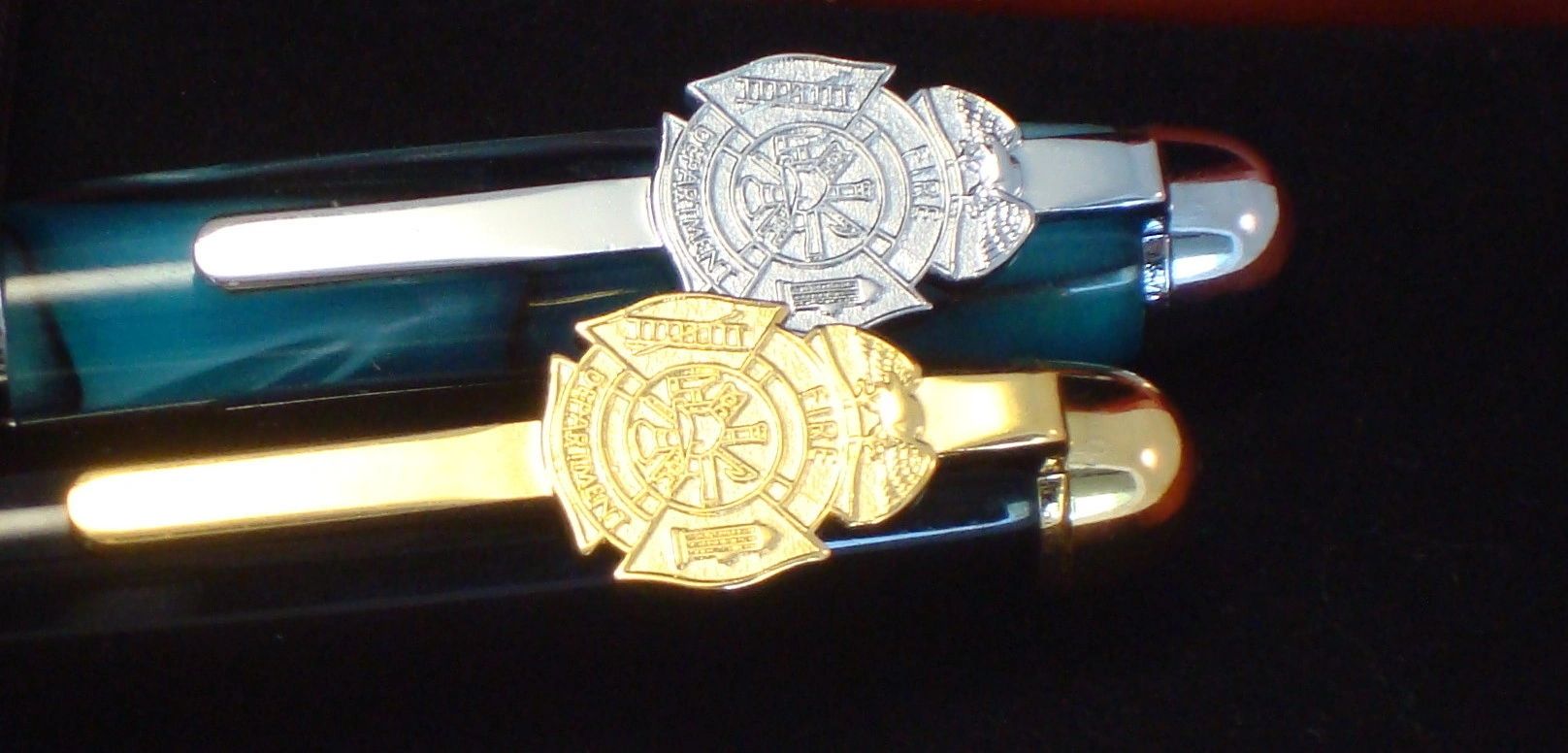 Elegant pens featuring firefighter badge designs.