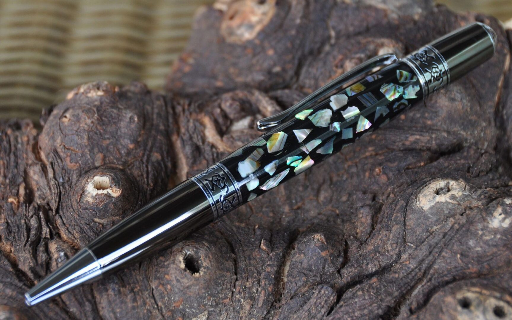 Decorative pen featuring shell inlay pattern.