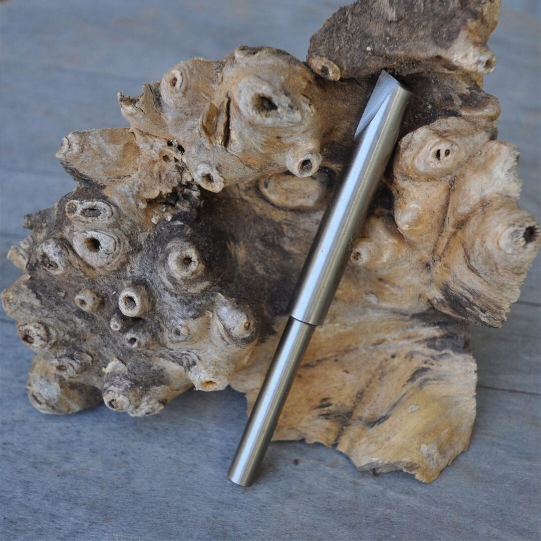 Metallic tool on textured wood