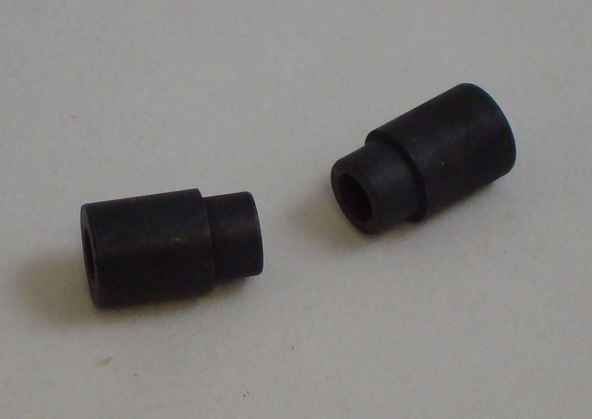 Rubber stoppers on white surface