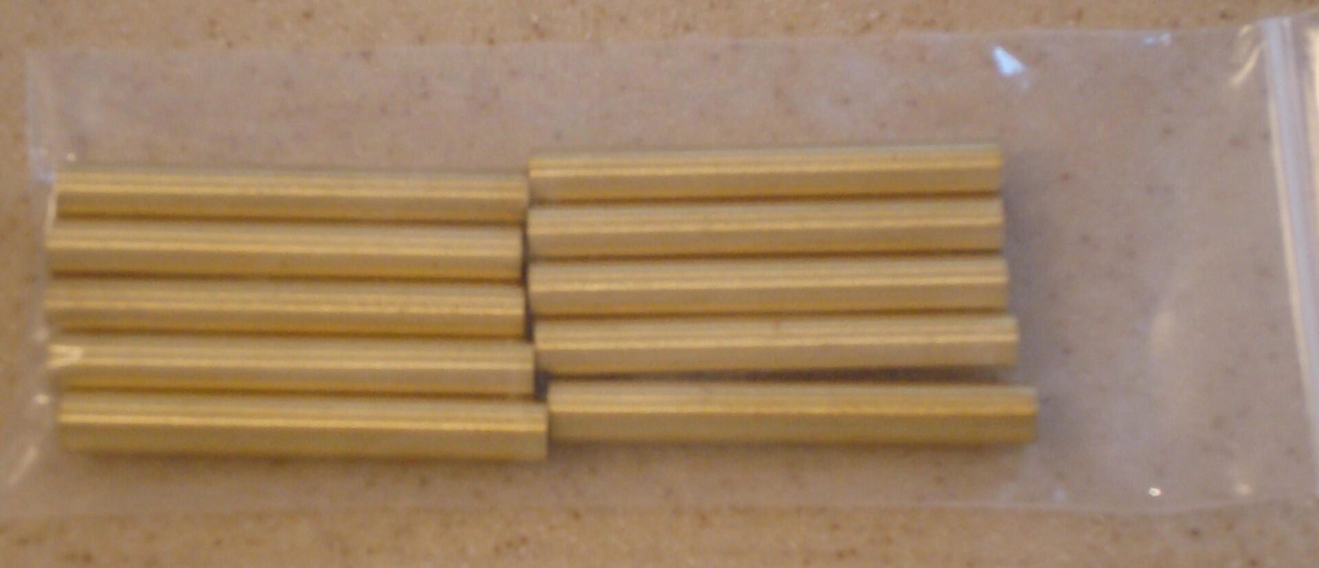 Brass rods in a plastic bag