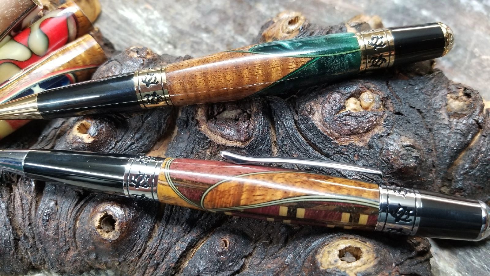 Elegant wooden pens on textured background