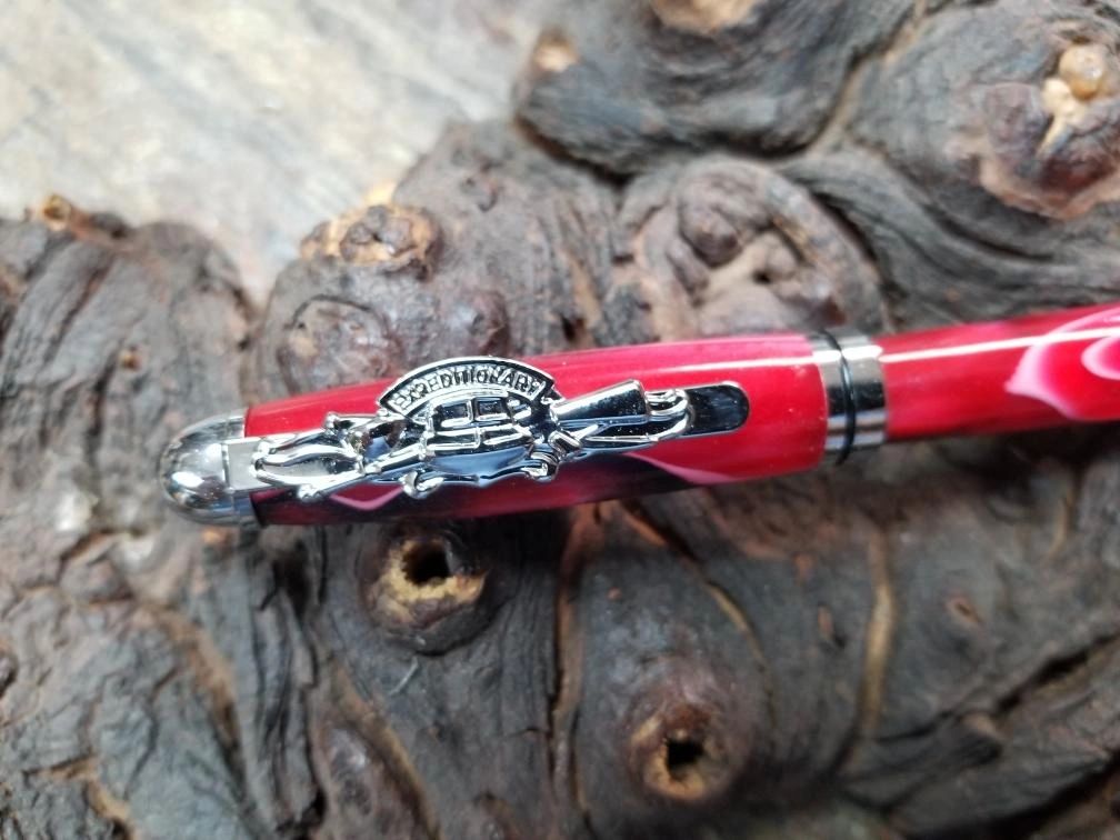 Close-up of a red writing pen