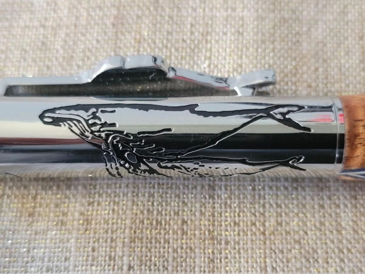 Silver pen clip with whale engraving