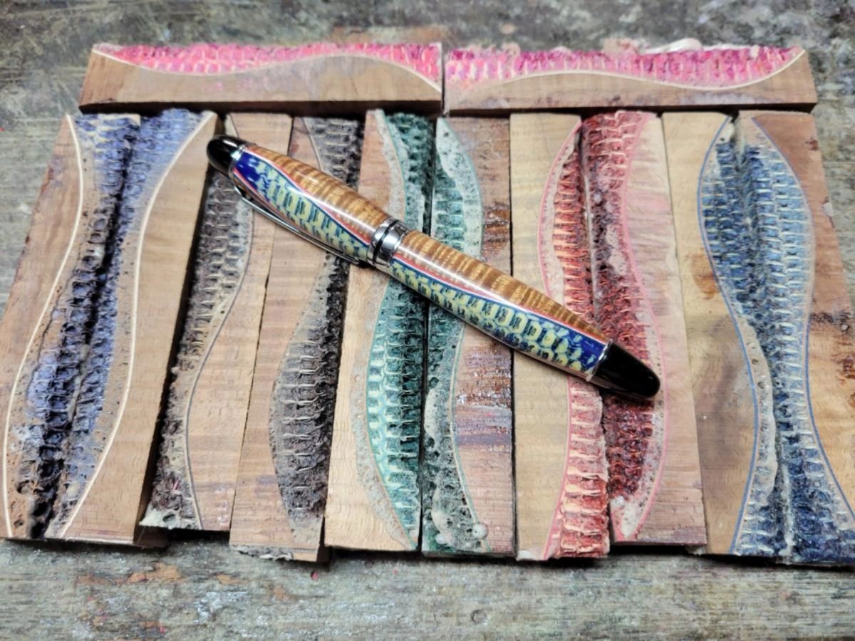 Colorful pen on textured wooden blocks