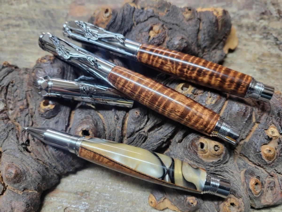 Wooden pens on rustic background