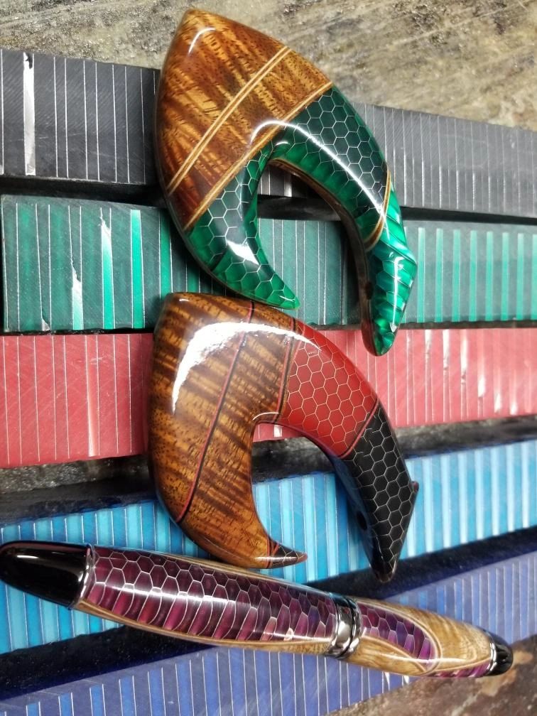 Artistic knife handles with hexagonal patterns.