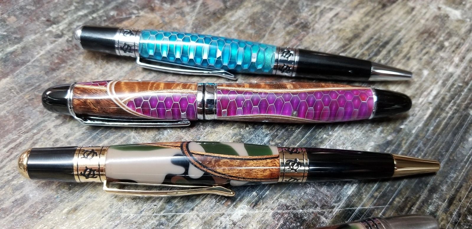 Colorful pens on wooden table