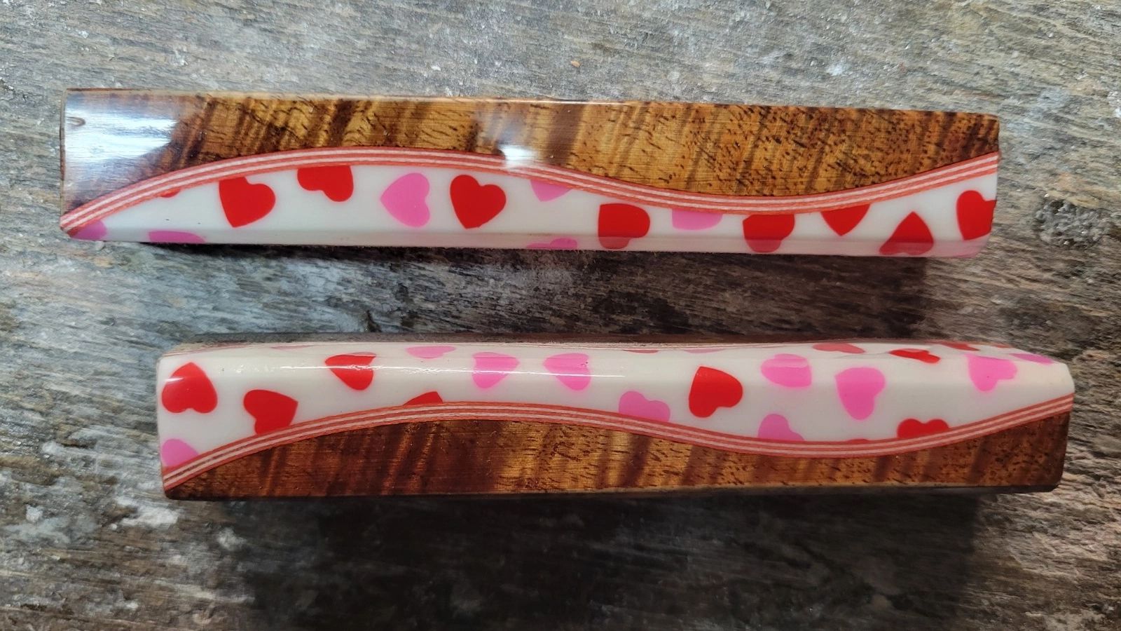 Two pen blanks featuring heart motifs.