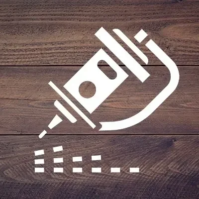 Tattoo machine icon on wooden background